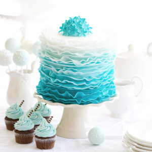 45305828 - ombre ruffle cake on a dessert table