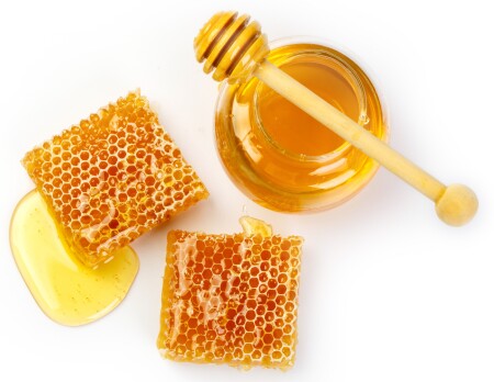 Bee,Products,With,Honey,And,Sweet,Honeycomb,Isolated,On,White