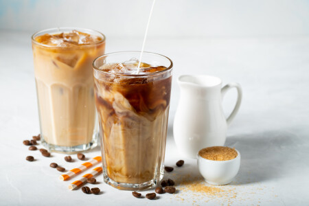 Ice,Coffee,In,A,Tall,Glass,With,Cream,Poured,Over